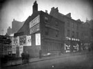 Old Queens Head, No. 18 Castle Street and No. 16 derelict Mart and Chapman, grocers, right