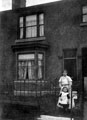 Sally Parkin (nee Bond) and her daughter Mary outside their house in Brightside on unidentified street