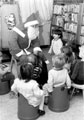 Father Christmas visiting children at Gleadless Library 	