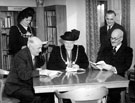 View: u01349 Opening Day Ceremony at Ecclesall Library, Knowle Lane, group includes Albert Ballard seated, (left), Lord Mayor, Alderman Mrs Grace Tebbutt (centre) and Sir Ronald Adam (seated, right) and Mrs O. Barton, Lady Mayoress