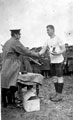 Soldier presenting unidentified cup