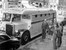 The first Sheffield Libraries Mobile Service, Surrey Street  outside the Town Hall with a group dignitaries including Councillor Enid Hattersley, Alderman Sidney Dyson and John Bebbington City Librarian