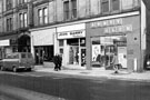 Union Street showing (l. to r.) No. 36 The Copper Coin, snack bar; No. 34 Jean Barry, ladies fashions and No. 32 Abbey Glen Laundry