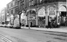 Norfolk Street, No 172, Army General Stores Ltd., No 174, Sheffield Health Food Stores. Building on left was formerly part of The Central Hall cinema, later renamed the New Tivoli. The cinema was destroyed in Blitz, however this part survived
