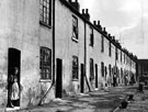 Rear view of a row of unidentified terraced housing in an unidentified location Rear view of a row of unidentified terraced housing in an unidentified location