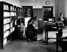 Central Library, Surrey Street. Book Stocks and Cataloguing Department, Miss Jones and Miss Martin pack skips ready for delivery to the Branches