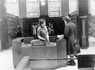 Miss Bowers at Enquiry Desk, Central Lending Department, Central Library, Surrey Street