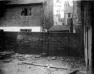 Looking towards Court No. 1, Moore Street (behind wall), from Court No. 2, Green Street. Rear of properties facing Thomas Street in extreme background