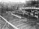 City Hall under construction showing the re-inforced base for first floor balcony. Cambridge Street and Barker's Pool in background. Water Company Offices on right, in background