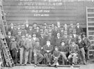 Employees of J. Puttrell and Co., painters and decorators, No. 94 South Street (later renamed The Moor) with James  Puttrell seated centre of front row