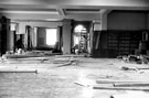 Interior of Hillsborough Branch Library, Middlewood Road, Hillsborough Park, showing new floors, wireing, etc. Joiner on left is boxing in new support girders, plasterer on right. Formerly Hillsborough Hall