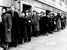 Section of queue outside Central Library, Tudor Street, going into the Library Theatre on a Saturday afternoon to see a film show