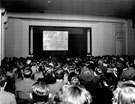 Back of the audience during a film show at the Library Theatre, Central Library