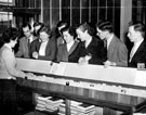 Party of students from the Leeds School of Librarianship visit Manor Branch Library, Ridgeway Road. Mrs B. Bradshaw, of Gleadless, (a library assistant), explains the system to some of the pupils