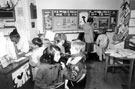 Young Readers in the Childrens Section of Burngreave Library, Gower Street showing display for World Cup 1990 with Yvette Garrison at the counter