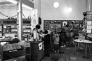 Young Readers  in the Childrens Section of Burngreave Library, Gower Street showing display for World Cup 1990 with Library Assistant Alison Cooper at the counter