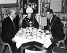 Alderman John Thorpe, Chairman of Libraries Committee, Lord Mayor, Mr John Stenton Worrall and Lady Mayoress, Mrs Worrall having tea after opening of the Junior Library, Burngreave Library, Gower Street