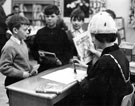 Lady Mayoress, Mrs Worrall discharging books for children after the opening of the Junior Library, Burngreave Library, Gower Street