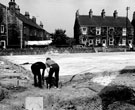 Checking the base during the construction of Handsworth Library, Hendon Street, at junction of Hall Road