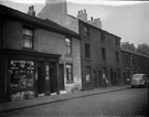 Nos. 38 - 46 Boston Street (formerly New George Street). Court No. 8, at rear of derelict back to back houses in centre. No 46, Mrs Eliz. Ann Bradford, Shopkeeper, left
