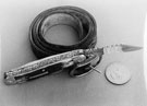 Pocket Knife made by Stanley Shaw, cutler, 48 Garden Street with a belt and an American Dollar to provide scale