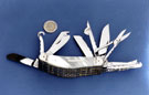 Eleven Piece Pearl Exhibition Knife made by Stanley Shaw, cutler, 48 Garden Street a 20p piece provides scale