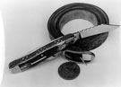 Pocket Knife made by Stanley Shaw, cutler, 48 Garden Street with a belt and an American Dollar to provide scale
