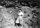 Elizabeth (Bach) Healey standing in the site of a crater made by a German bomb dropped on the night of 12/13th December 1940 at the bottom of the garden of 76 Crawford Road, Norton Lees