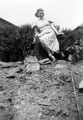 Elizabeth (Bach) Healey standing in the site of a crater made by a German bomb dropped on the night of 12/13th December 1940 at the bottom of the garden of 76 Crawford Road, Norton Lees