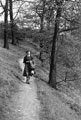 Hazel Brackenbury walking down the path from Lees Hall through the upper part of Carr Wood