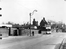 Bus turning into Granville Road from Suffolk Road looking towards Farm Road with The Farm and the lodge in the background  with bus turning into Granville Road