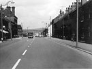 View: u04527 Queens Road looking towards No. 52, Earl of Arundel and Surrey public house and St. Wilfrids R.C. Mission (left) with Hodkin and Jones, Havelock Bridge Works at the junction with Myrtle Road (right)