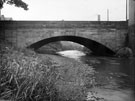 High Bridge, Penistone Road North over the River Don looking downstream with the roof of the Wardsend House Lodge (extreme left); chimney of High Forge (right) and Wardsend Steel Co., Wardsend Steel Works visible under the bridge