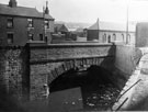 Queens Road Bridge, Queens Road (built 1873) over the River Sheaf looking upstream showing Chas Black and Sons Ltd., timber merchants