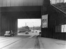 Prince of Wales Railway Bridge looking towards Poole Place, showing the narrow footway and the notice board advertising rail excursions to Cleethorpes and Mablethorpe