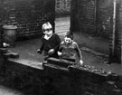 Boys playing football in the yard possible location Attercliffe or Park area Boys playing football in the yard possible location Attercliffe or Park area