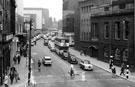 Elevated view of evening traffic in Castle Street with the Court House, formely the old Town Hall  (right); Arthur Davy and Son Ltd., provision merchants and Cannon Hotel (left)