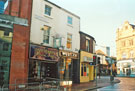 Fitzwilliam Street looking towards West Street showing No. 6 David Shepherd, opticians and No. 4 West One Lettings, student accommodation