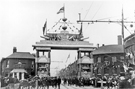 East End decorative arch, Savile Street East for the royal visit of King Edward VII and Queen Alexandra with Thomas Firth and Sons, West Gun Works right and No. 208, Norfolk Arms, Joseph Badger victualler left 
