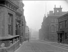 View: u05692 No.36 The Sheffield Club (left) and Joseph Rodgers and Sons Ltd., Norfolk Street Works, cutlery manufacturer, Norfolk Street looking towards Fitzalan Square with the junction with Milk Street right