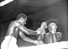 Commonwealth Light Middleweight Championship, Round 8, Herol Bomber Graham (left) v Champion, Kenny Bristol from Guyana