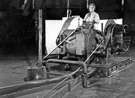 Female worker coiling strip steel at Hallamshire Steel and File Company, Neepsend Lane Female worker coiling strip steel at Hallamshire Steel and File Company, Neepsend Lane