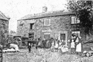 The Green Family outside their home St. Marys Croft Farm, Dungworth
