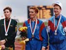 Great Britains' John Mayock from Barnsley, Mens 5,000m Winner with joint Silver Medalists D. Evans, Australia (left) and P. Sherry, U.S.A. (right) World Student Games, Don Valley Stadium