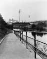 Entrance and Exit to the Towpath, Sheff and SYK Navigation with Don Valley Stadium in the background showing the Footbridge over the Canal: Railway and Supertram Tracks  
