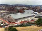 View: u06289 Elevated view from Park Hill of Ponds Forge Sports Centre under construction showing Gilbert Street Railway Bridge and the junction of Pond Hill and Sheaf Street in the foreground
