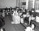 Librarians sorting a large amount of library books taken to Attercliffe Police Station, Whitworth Lane