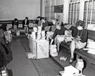 View: u06342 Librarians sorting a large amount of library books taken to Attercliffe Police Station, Whitworth Road. 