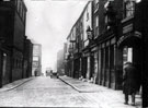 Button Lane looking towards junction with Carver Street. Premises on right include Nos. 18 - 22 Angel Inn (with arch). Rear of George Binns Ltd., tailors, left, fronting The Moor Button Lane looking towards junction with Carver Street. Premises on right include Nos. 18 - 22 Angel Inn (with arch). Rear of George Binns Ltd., tailors, left, fronting The Moor
