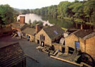 Elevated view of Abbeydale Industrial Hamlet, Abbeydale Road South, showing the Grinder's Shop and Crucible Steel Shop, Tyzack's Dam in background